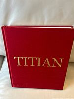 Front cover of red cloth hardcover with gold TITIAN lettering