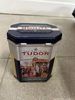 Front view of Tudor Earl Grey tin showing decorative panel and brand