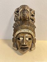 Front view of ceramic Pre-Columbian style wall mask showing full design