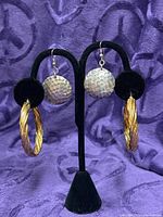 Both earring pairs on stand