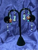 All three earring pairs on display stand