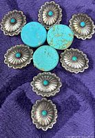 Group view showing three turquoise-topped and four concho-style button covers