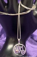 Necklace draped for length reference