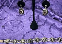 Bracelet and earrings full view on purple background