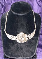 Full view of sterling silver necklace on display bust showing overall design
