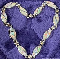 Entire bracelet arranged in heart shape showing all opal links