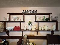 Overall wall shelf showing majority of milk glass and glass items