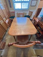 top view of light oak veneer table with chairs around