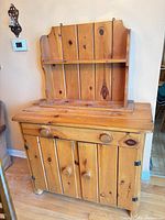 Front view of pine cabinet with upper hutch shelf attached