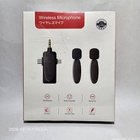 Front of box showing receiver and two microphones