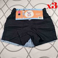 Front view of shorts pack showing black pair on top with retail header card