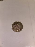 Reverse showing Canadian Coat of Arms and date 1942