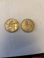 Reverse of both coins showing crowned lion design