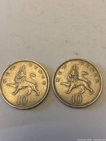 Both 10 New Pence coins showing reverse crowned lion design