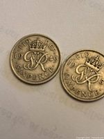 Two sixpence coins reverse side showing 1949 date and crowned cypher