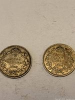 Obverse sides of both 1920 Canadian 5-cent coins showing King George V portraits