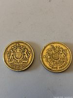 Reverse sides showing crowned Royal Arms design