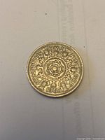 Reverse side showing crowned Tudor rose design, denomination and date 1965