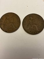 Obverse sides of both pennies showing George V portrait
