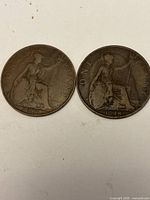 Reverse of both coins showing seated Britannia and dates 1917 and 1918