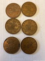 Front of six British 2 New Pence coins showing reverse design