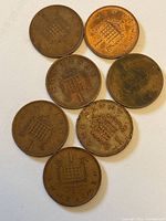 Seven coins reverse side showing portcullis design