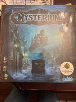 Front of sealed Mysterium box