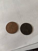 Front of both coins showing Britannia design and dates 1897, 1961