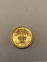 Reverse of 1985 £1 coin showing Welsh leek design and denomination