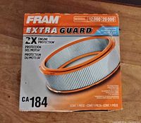 Front of retail box showing Fram Extra Guard branding and CA184 model