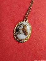 Front view of horse cameo pendant with chain