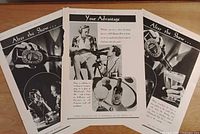 Overview of the three advertisement pages laid out on table