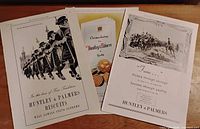 All three Huntley & Palmers advertisements side by side on tabletop