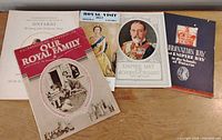 Five vintage Royal Family publications laid out to show covers