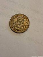 Reverse of 1942 sixpence showing crowned monogram and date