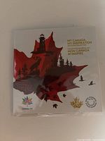 Front of sealed coin set packaging with Canada 150 logo and bilingual title