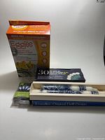 All four boxed items: Eggies cooker, LED string lights, tealight candle box, Delft candles