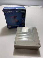 Sealed stack of floppy disks with retail box