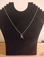 Full necklace displayed on stand showing pendant size and chain length