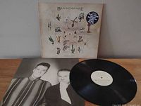 Front cover, vinyl record, inner sleeve portrait side