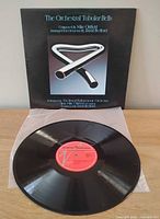 Front sleeve showing title and artwork with record on clear inner sleeve