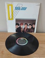 Front jacket and vinyl record displayed