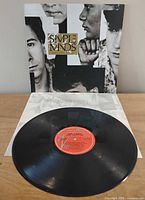 Front cover of album with vinyl disc displayed