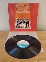 Front of album jacket with vinyl record displayed