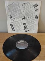Front of printed inner sleeve and vinyl record showing label.