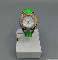 Front view of wristwatch on display stand