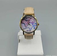 Front view of watch showing dial design and strap