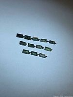 Twelve baguette-cut sapphires in staggered rows