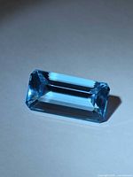 Top view of the Swiss blue topaz showing emerald step cut and vivid blue color