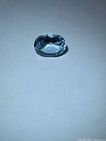 Front view of oval Swiss blue topaz
